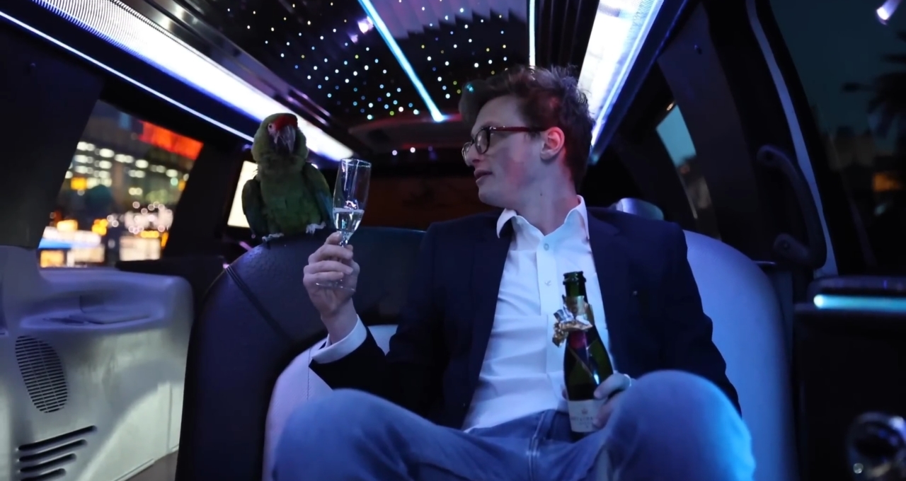 Max Fosh and a parrot in a Las Vegas limo